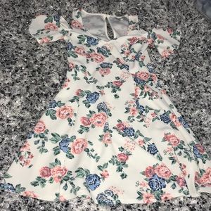 a white and floral dress.